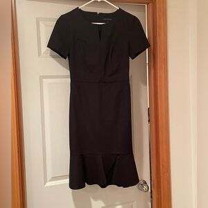 Women’s black trumpet dress with ruffle bottom